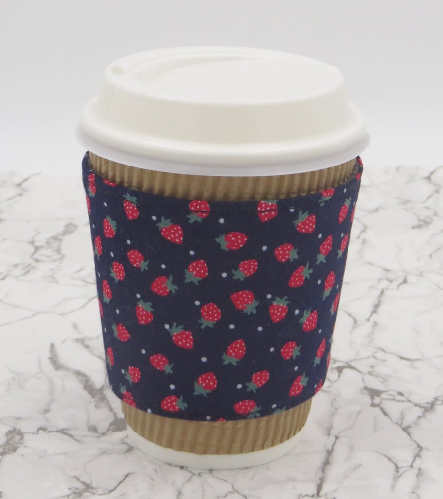 Fabric Cup Cosy in strawberry print, fully reversible and reusable cup holder