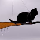 Hand made stained glass, cat on a broomstick 