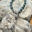 Beaded gemstone bracelet with star charm