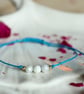 Delicate bracelet with Moonstone in turqoise colour cord - Image 1