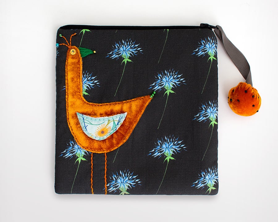 Black thistle make up bag with orange velvet appliquéd bird