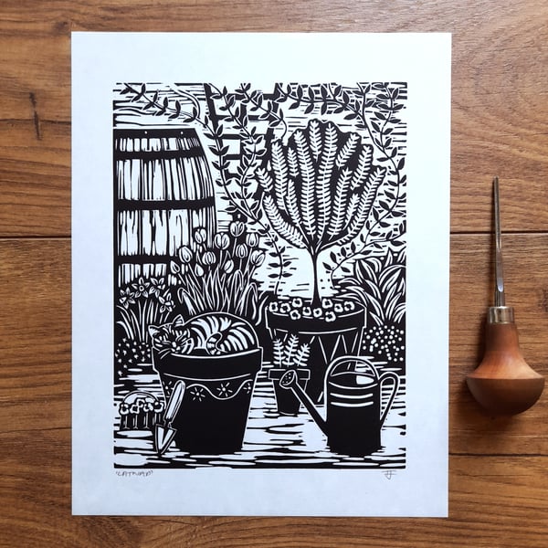 Catnap - cat sleeping in the garden linocut