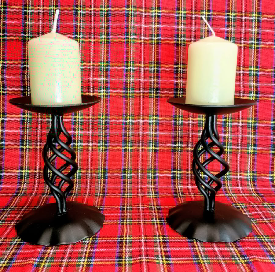 A pair of tall blacksmith-made candlesticks in Baronial style. 