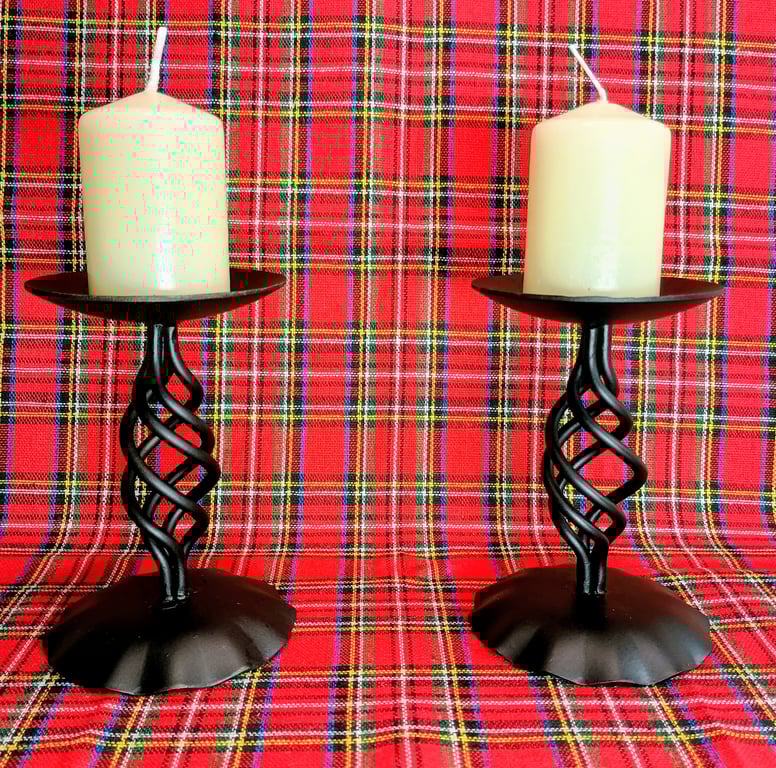 A pair of tall blacksmith-made candlesticks in Baronial style. 