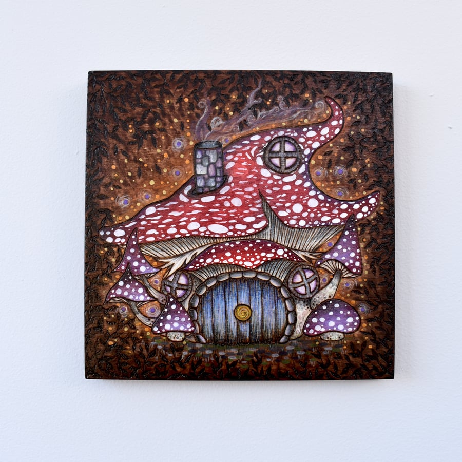 The Toadstool House. Pyrography hand burned wood canvas.