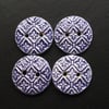 set of four purple patterned ceramic buttons