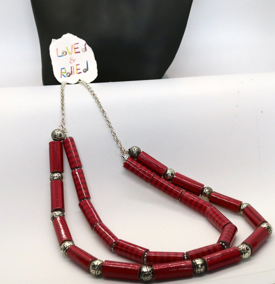 Double stranded long necklace with red lined tubular paper beads