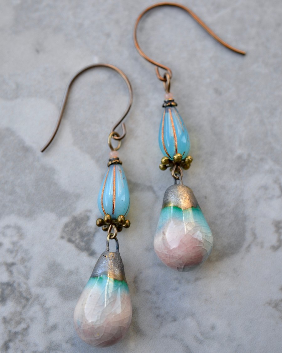 Long artisan ceramic earrings in blue, pink and bronze