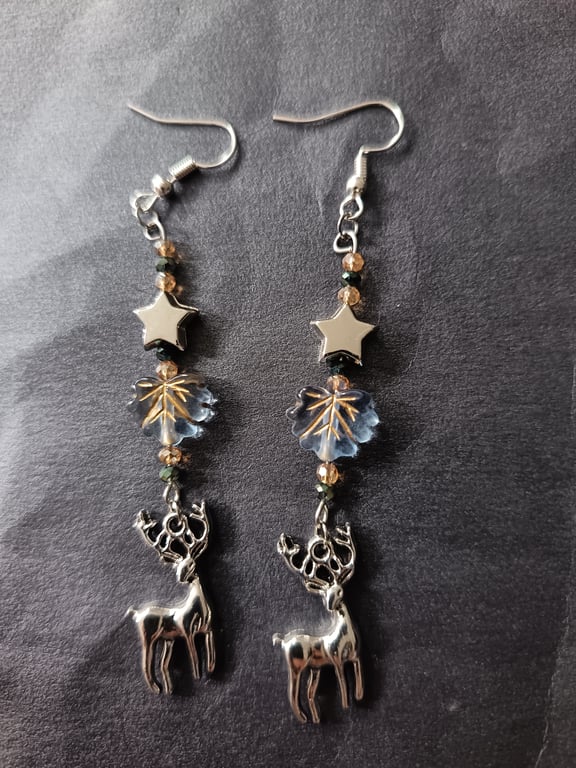 Wintry beaded star and leaf dangle earrings with silver stag charm 
