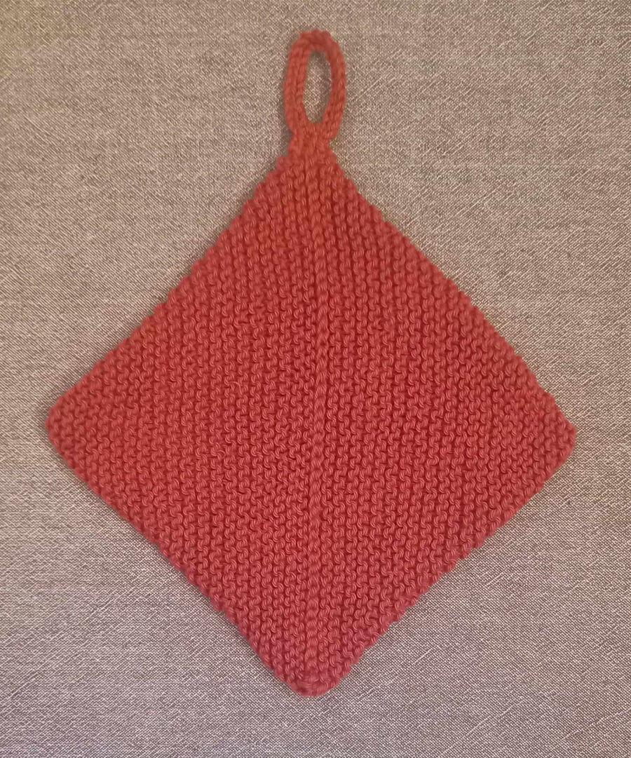 Hand knitted 100% cotton hot pot holder in burnt orange
