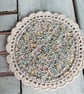 Set of four floral coasters with crochet edge. - Image 2
