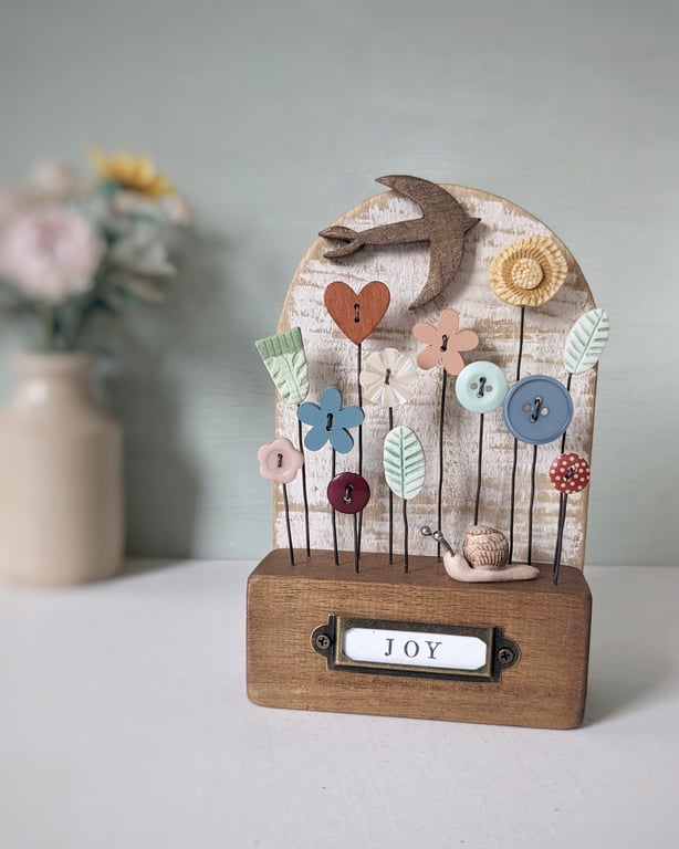 Wild Flower Garden with Bird and Snail in Wood and Clay