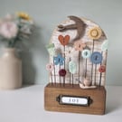 Wild Flower Garden with Bird and Snail in Wood and Clay