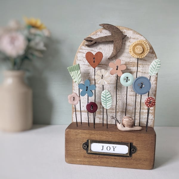 Wild Flower Garden with Bird and Snail in Wood and Clay