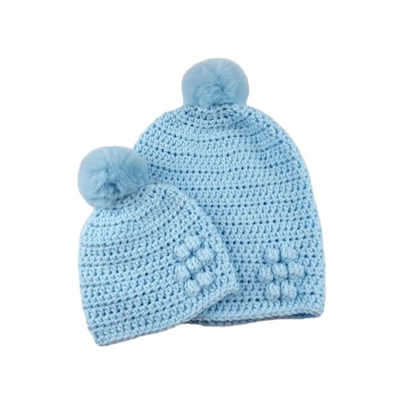 Matching ladies and baby blue crocheted hats with detachable faux fur pompoms 