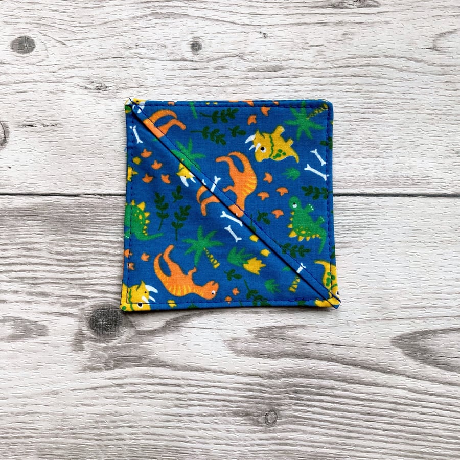 Dinosaurs on blue polycotton fabric corner bookmark. Book lovers gift.