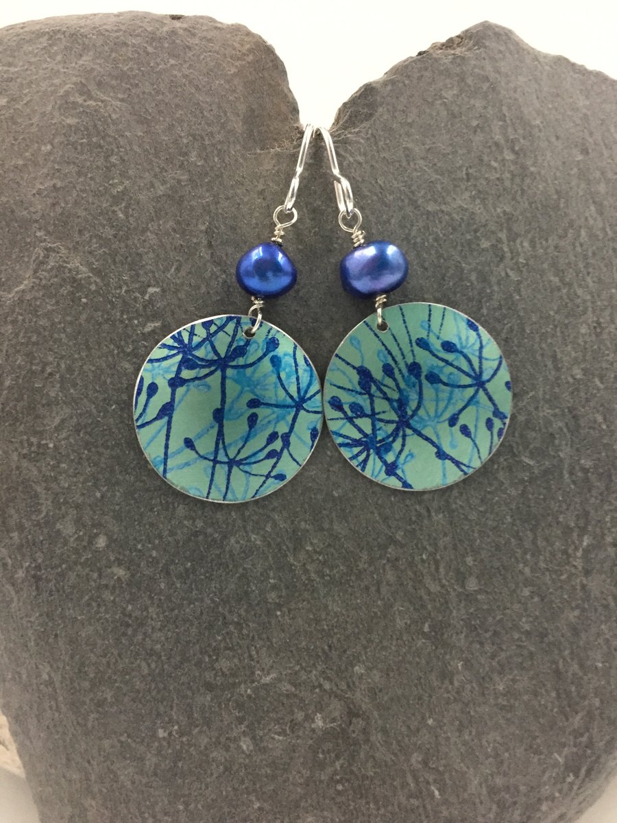Teal and blue aluminium cow parsley circle earrings with blue pearl.