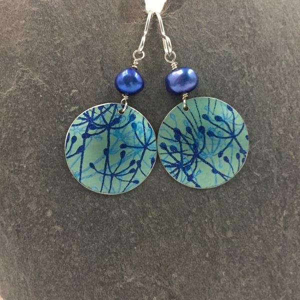 Teal and blue aluminium cow parsley circle earrings with blue pearl.