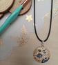 Circular patterned hand painted wooden necklace 