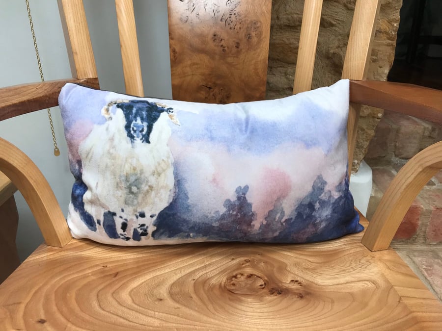 Gorgeous sheep in snow cushion designed by British artist