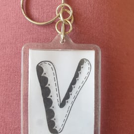 Hand drawn initial "V" keyring.