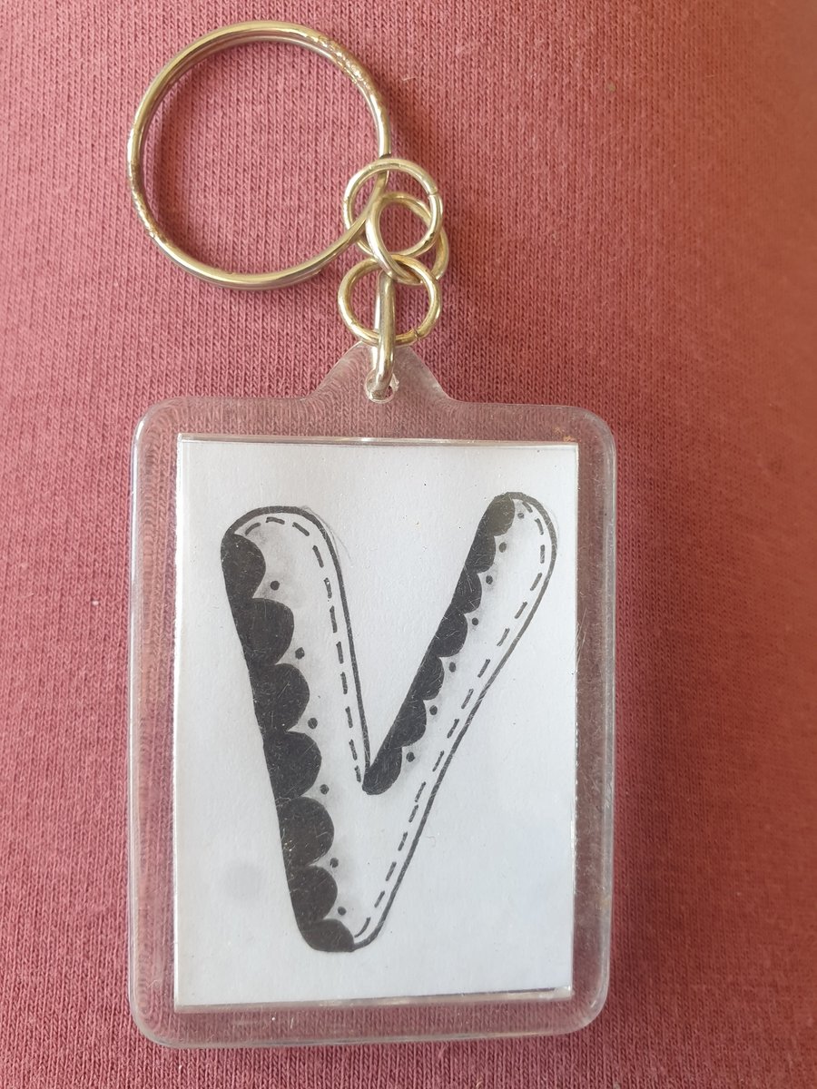 Hand drawn initial "V" keyring.