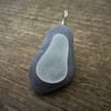 Pendant - frosted white sea glass on dark beach stone