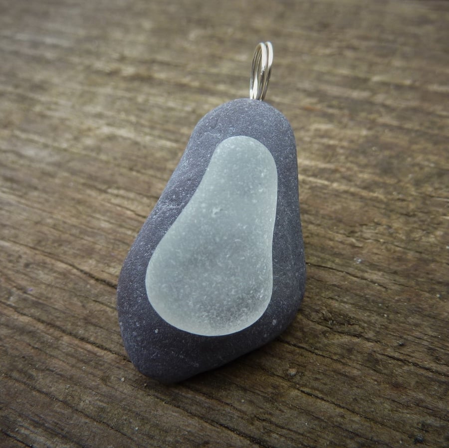 Pendant - frosted white sea glass on dark beach stone