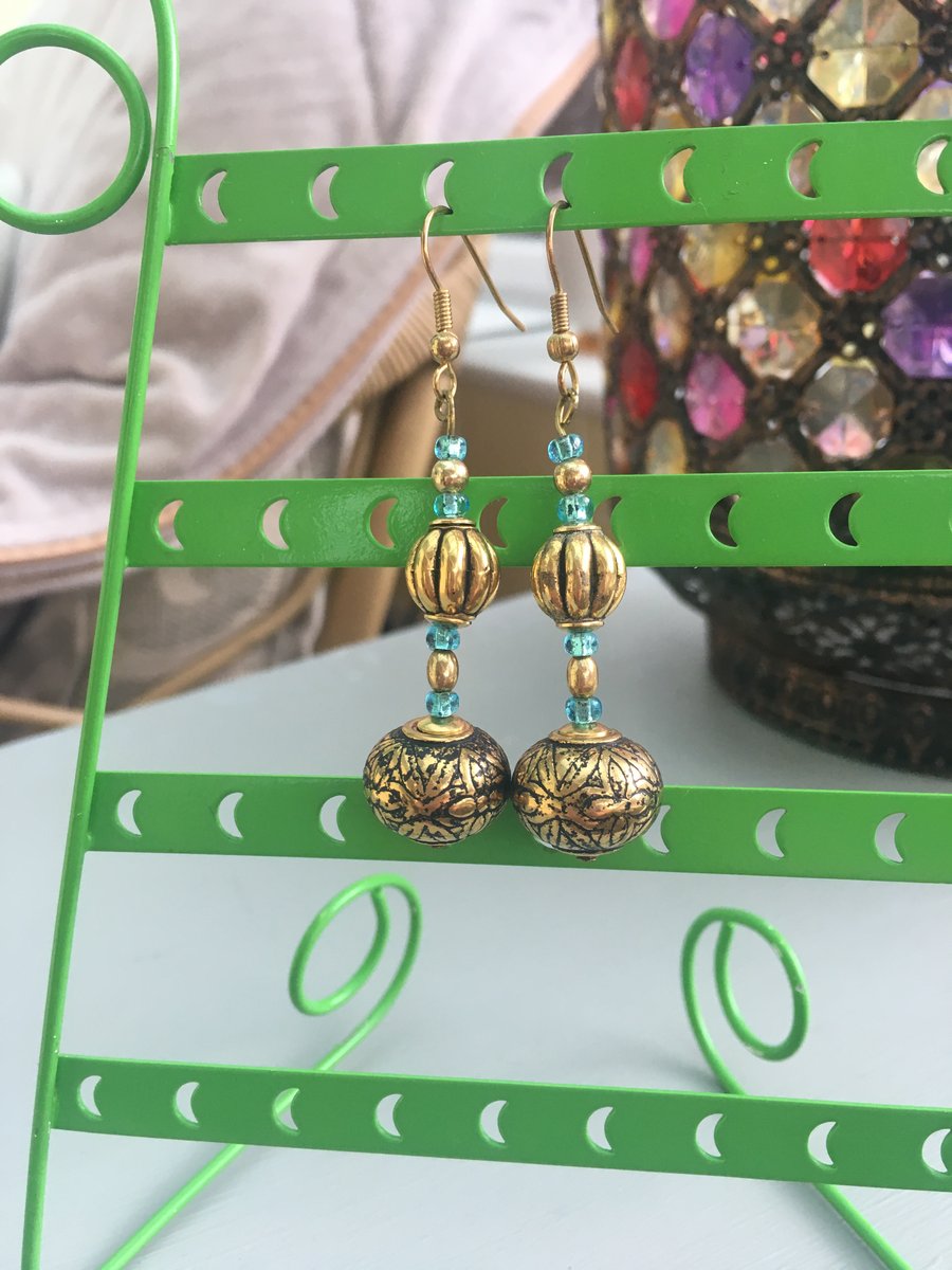 Gold embossed metal bead dangle earrings