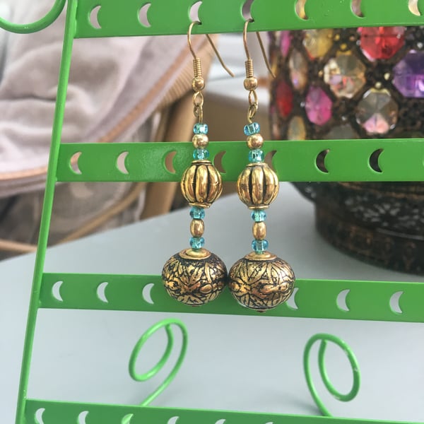 Gold embossed metal bead dangle earrings