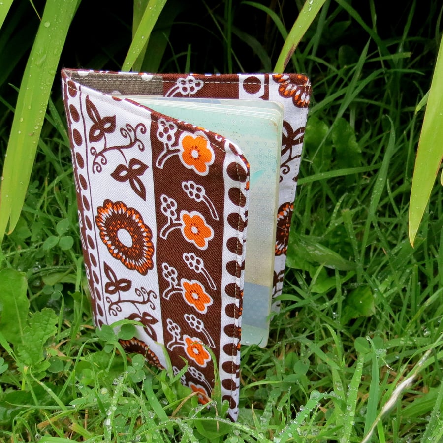 Groovy flower power.  A passport sleeve made from a vibrant 1960s cotton.