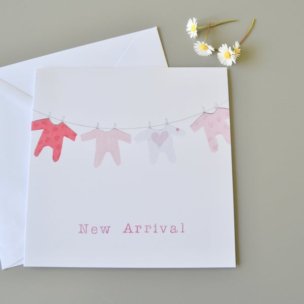 New Baby Girl 'New Arrival' Card with washing line of pink babygros