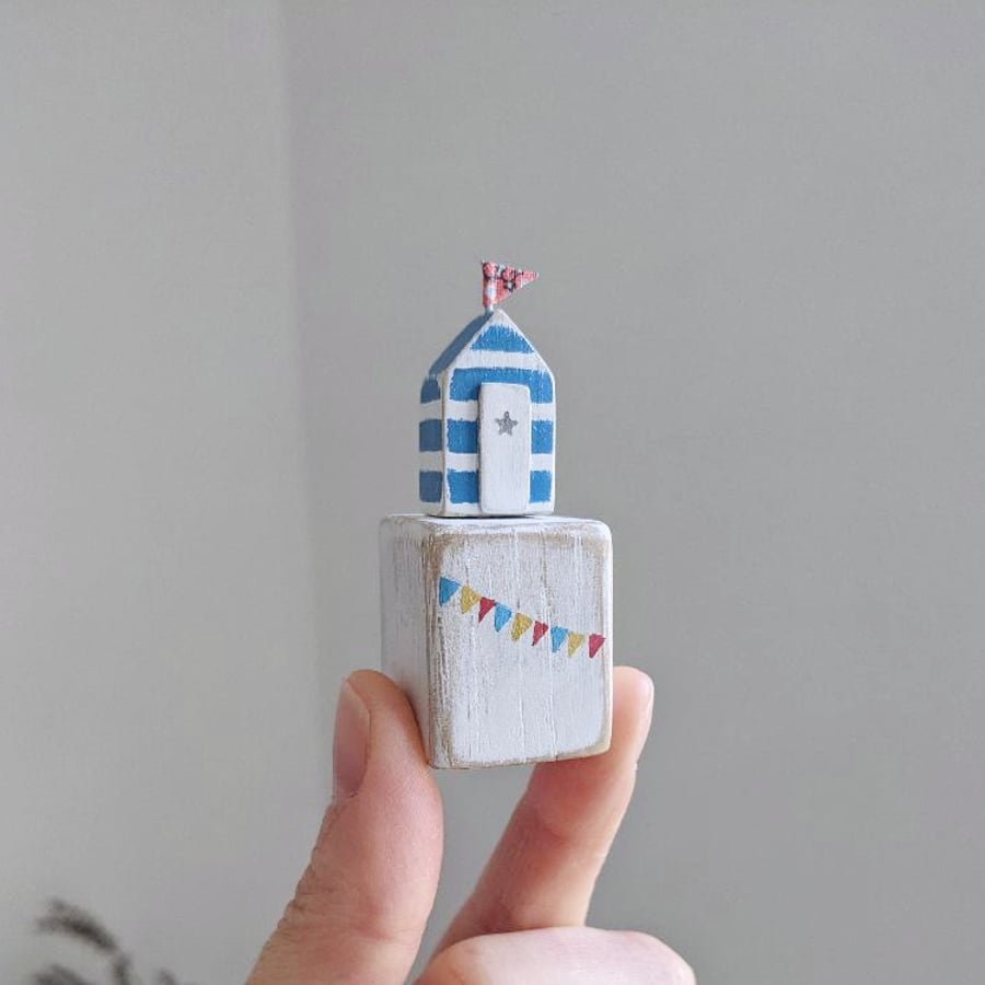 Tiny Turquoise Stripe Beach Hut on a Wooden Block with Bunting