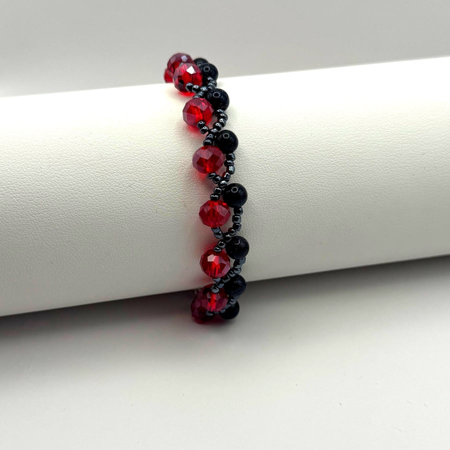 Red & Black Beaded Bracelet with Blue Goldstone – Sterling Silver Clasp