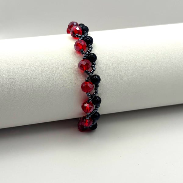 Red & Black Beaded Bracelet with Blue Goldstone – Sterling Silver Clasp