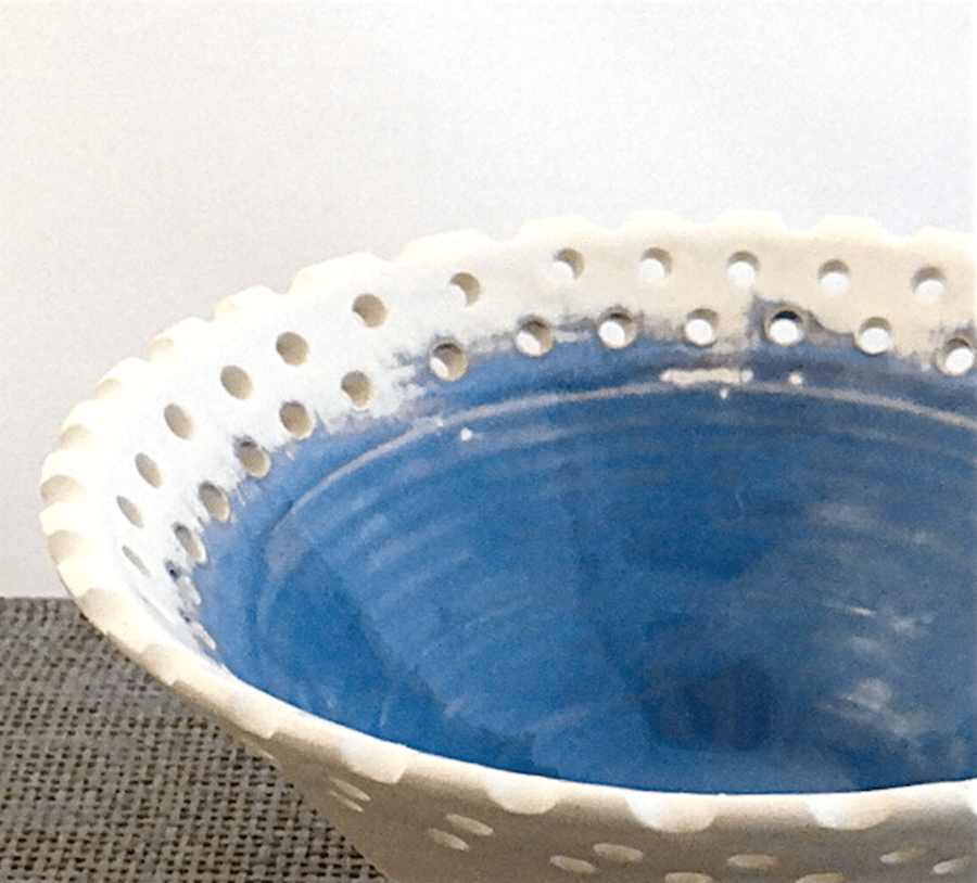 Decorative blue and white ceramic bowl with pierced rim - white earthenware 