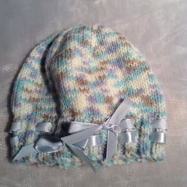 Little spotty knitted baby hat with ribbon