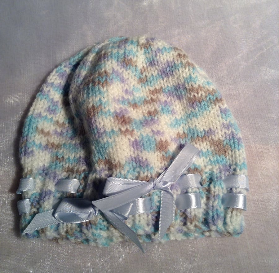 Little spotty knitted baby hat with ribbon