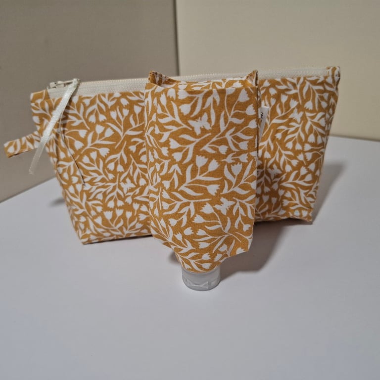 Cosmetic bag with matching hand sanitiser holder set