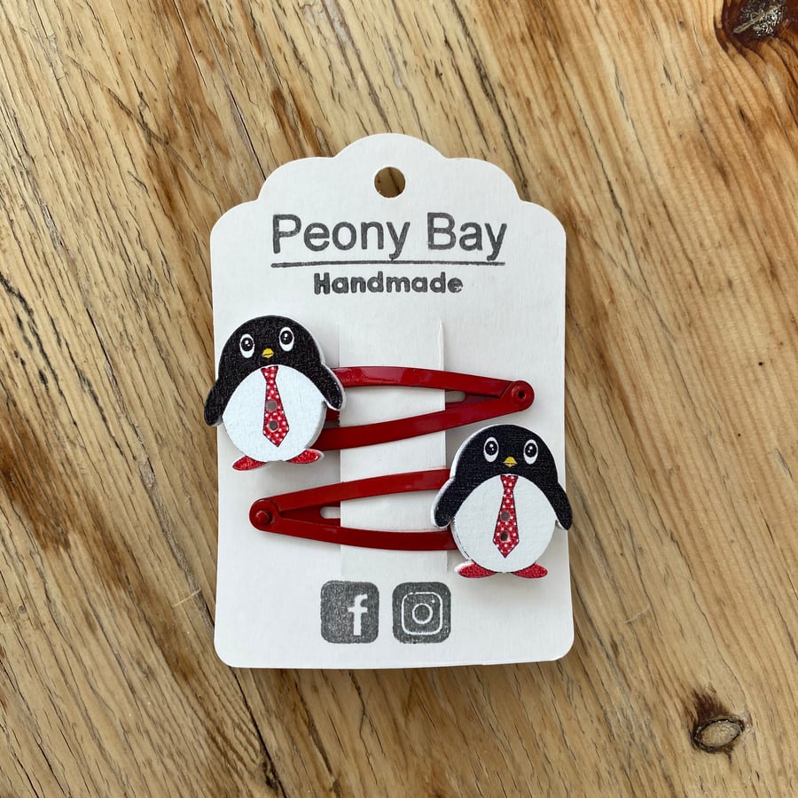 Girl’s penguin hair clips in red