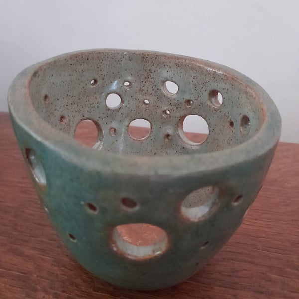 Handmade ceramic pot with hole decoration 