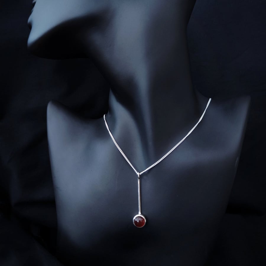 Silver pendant with round carnelian