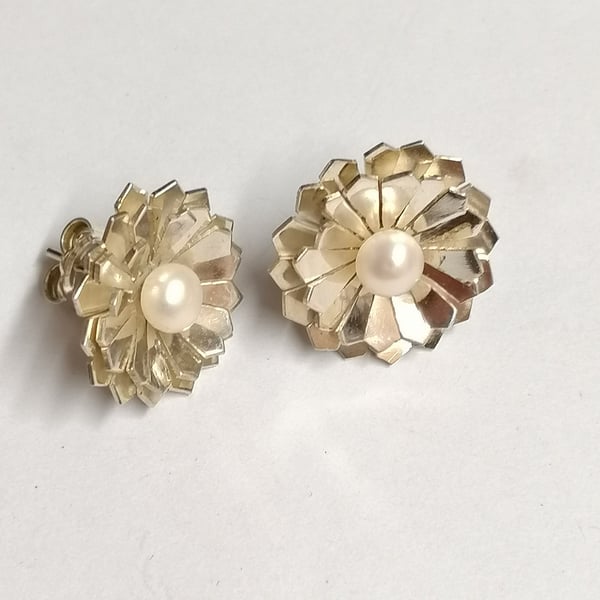 Chicory studs hand made from silver set with a Pearl