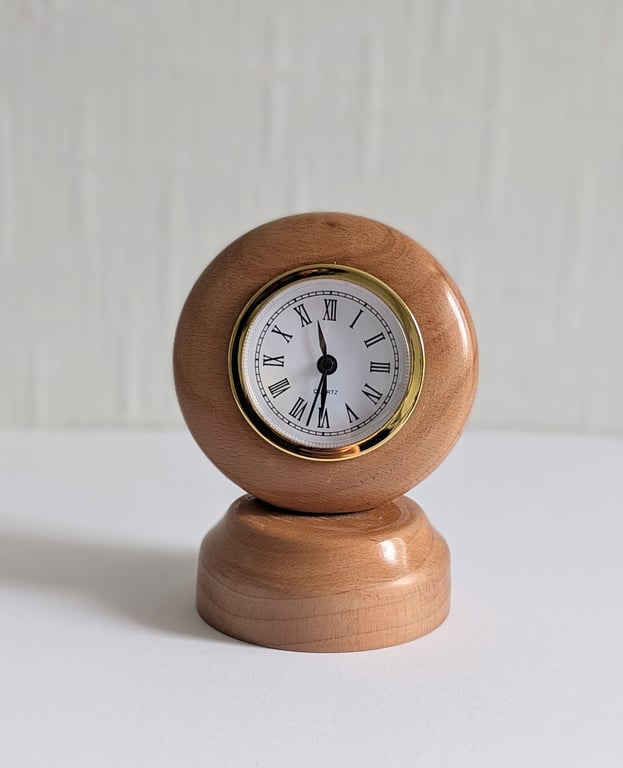 Cherry wood gold rimmed clock on stand
