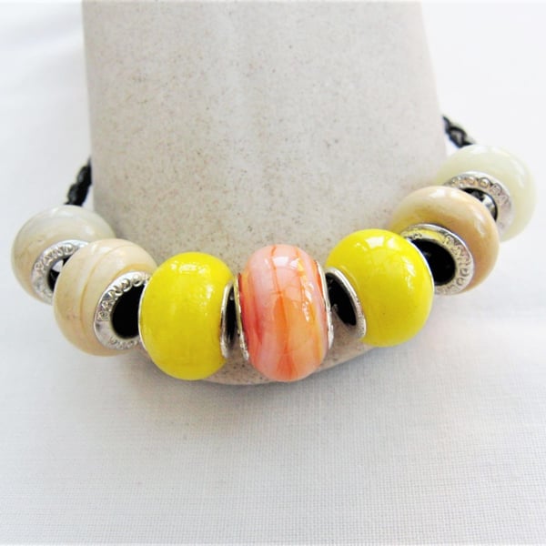 Yellow and Coffee Lampwork Bead Bracelet on a Plaited Leather Band
