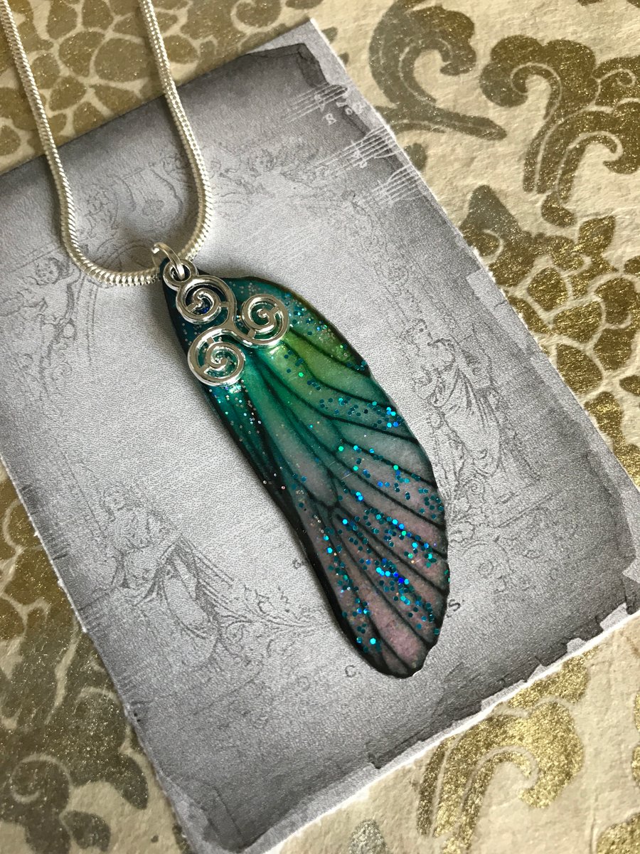 Glittery blue and green sterling silver triskelion fairy wing necklace