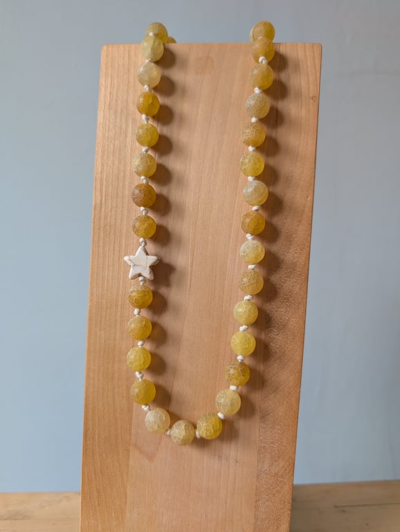 Yellow frosted agate bead and howlite star knotted cord necklace 