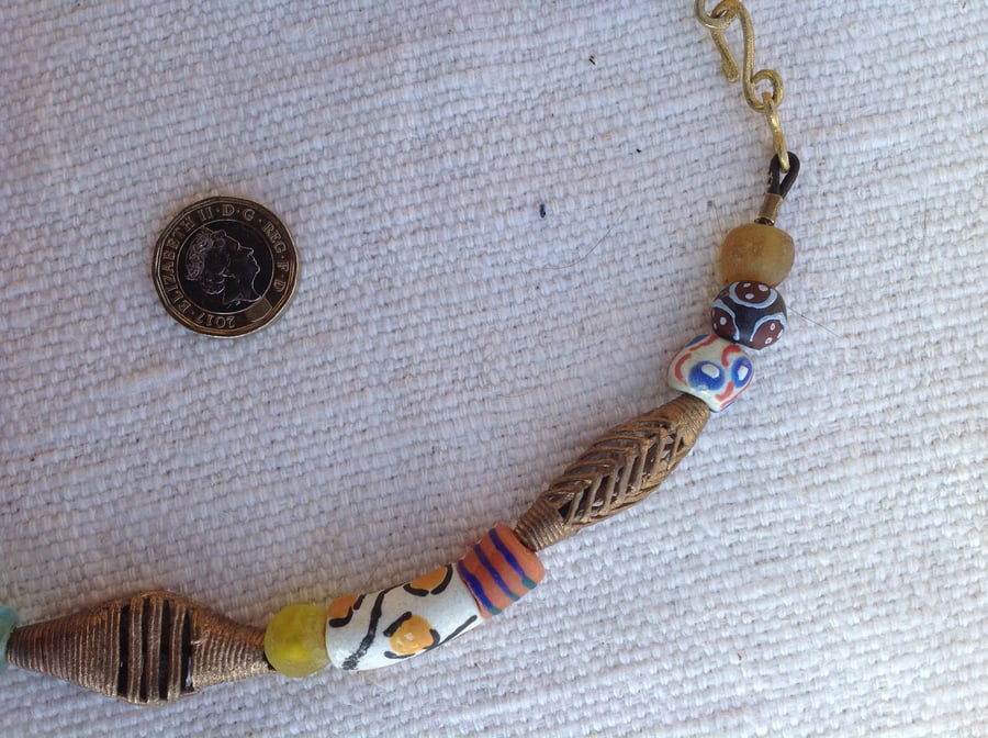 Necklace with West African recycled brass and glass beads and one from Nepal
