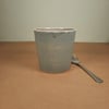 Handleless grey stoneware ceramic mug