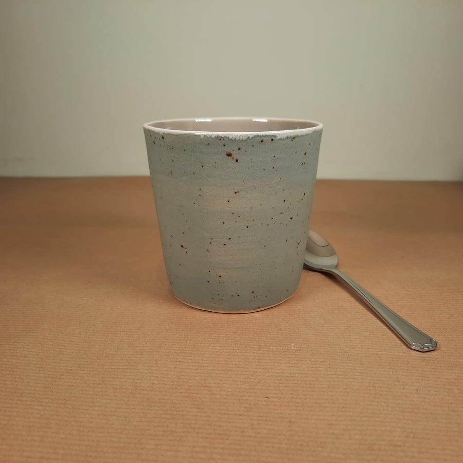 Handleless taupe and grey stoneware ceramic mug